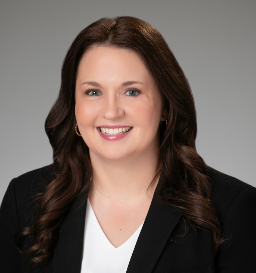 Smiling woman in a business suit portrait.