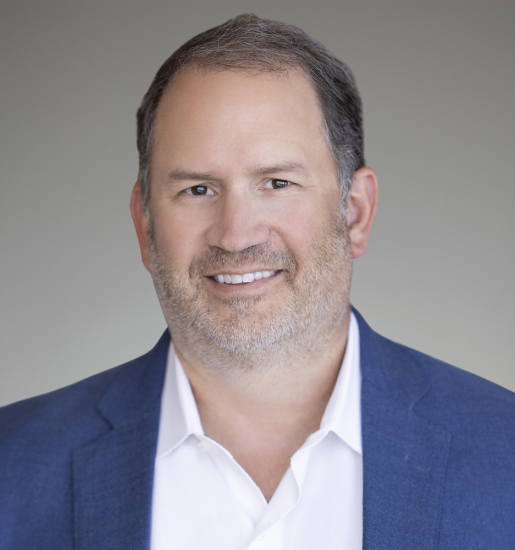 Smiling middle-aged man in blue blazer headshot
